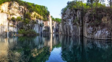 A small lake in Pocheon art valley. An old granite quarry turned into park with famous granite cliffs reflecting on the lake.