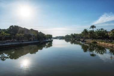 Thu Bon river and An Hoi town reflection taken from Hoi An Ancient town river bank.