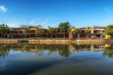 Thu Bon river and An Hoi town reflection taken from Hoi An Ancient town river bank.