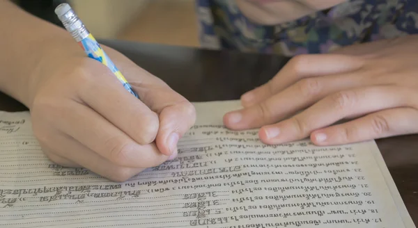 Young asian kids writing letters — Stock Photo, Image