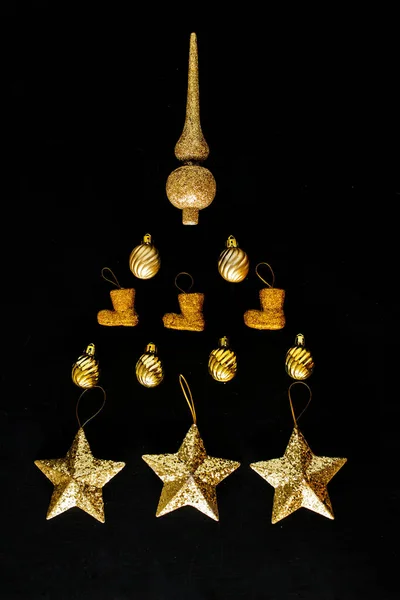 Golden Christmas Ornaments Forming Silhouette Tree — Stock Photo, Image