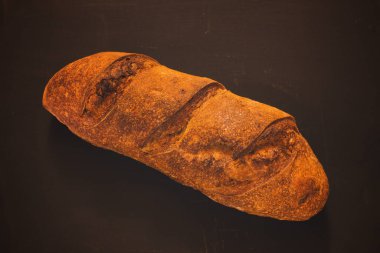 fresh sourdough bread black background