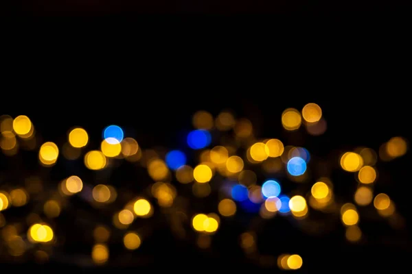 Красивий Фон Викривлених Блискучих Синьо Жовтих Круглих Кіл Ізольованих Чорному — стокове фото