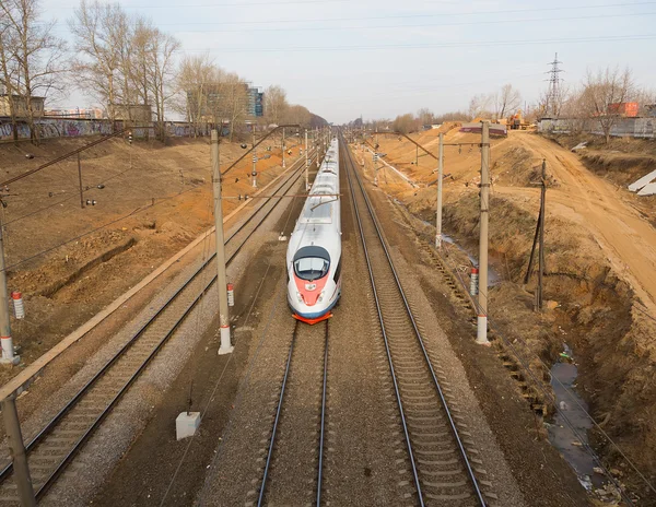 The high-speed train moves on a railroad line
