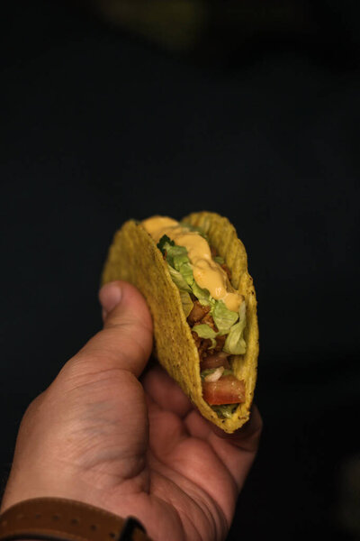 mexican food- taco blur Cheddar cheese sauce 