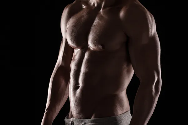 Strong Athletic Man Fitness Model Torso showing six pack abs. — Stock Image Strong Athletic Man Fitness Model Torso showing six pack abs. Royalty Free Stock Photos