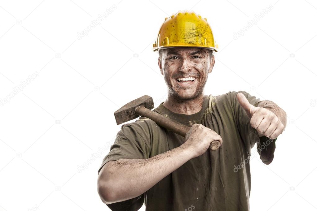 Young dirty smiling Worker Man With Hard Hat helmet