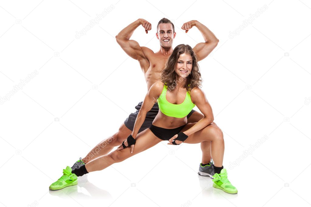 beautiful young sporty couple posing and showing muscle