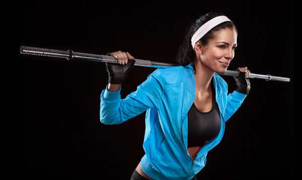 Woman exercises with barbell dumbbell — Stock Photo, Image