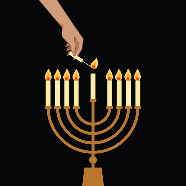 Hand Lighting Candle On Metal Hanukkah Menorah On Surface Against Black Background. Man lighting up candles in menorah. Jewish Woman Celebrating Holidays Hanukkah
