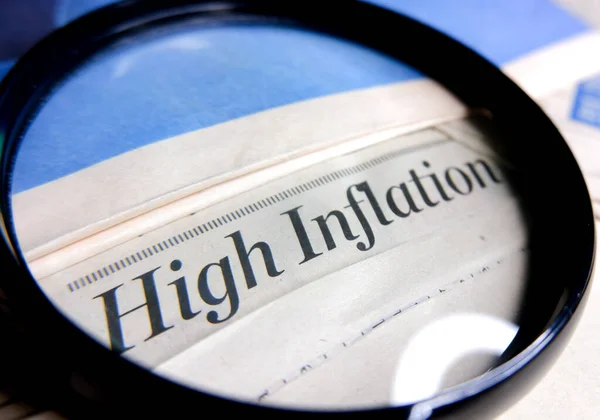 Concept of high inflation with magnifying glass.