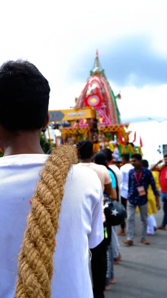 North 24 parganas, West Bengal dated 09.10.2022. Young boy carries the holy rope on this shoulder to pull the rath during rath yatra.