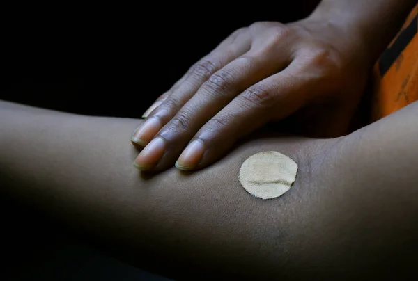 Band-aid is applied after injection prick.