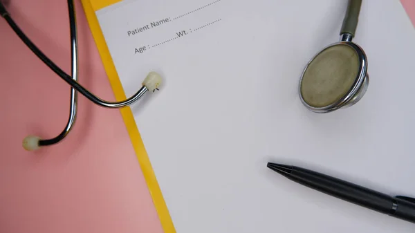 Concept of healthcare with stethoscope, prescription pad and pen.