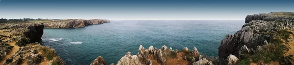 panoramic photo of the cliffs and beach of Prias, Asturias, Spain,