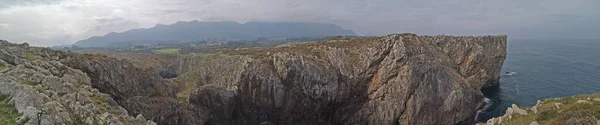panoramic photo of the cliffs and beach of Prias, Asturias, Spain,