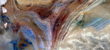 abstract landscape photo of the deserts of Africa from the air emulating the shapes and colors of the womb of death,, Genre: Abstract naturalism, from the abstract to the figurative