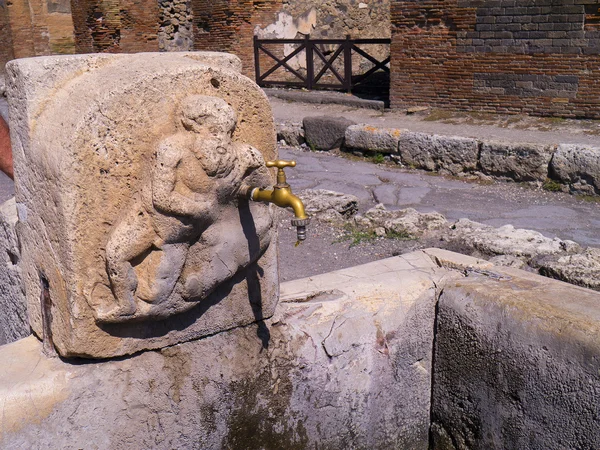 Street fountain still usable in the Ruins in the once buried city of Pompeii Italy — Stock Photo, Image