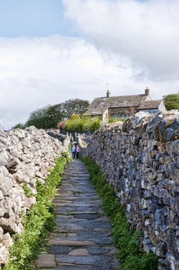 Linton near Grassington in North Yorkshire England is an area of outstanding natural Beauty clipart