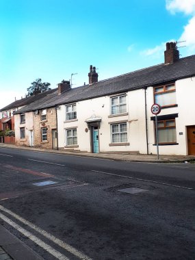 Lancashire, Padiham 'a giden yol üzerindeki küçük kulübeler. Bu bölgede Cotton Mills ve Kömür Madenleri' nden işçileri barındırıyorlar ve muhtemelen 18. yüzyıldan kalma. Belki de el dokuma tezgahı dokumacılarının evleriydiler.