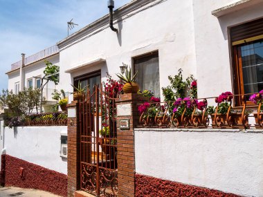 Capri has been a resort island since Roman times . It is situated in the Bay of Naples and is covered with architecture from all the successive generations