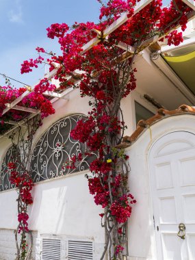 Capri has been a resort island since Roman times . It is situated in the Bay of Naples and is covered with architecture from all the successive generations