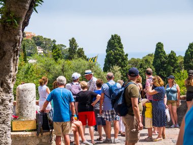Crowd of Tourists doing a walking tour on the Isle of Capri in Italy