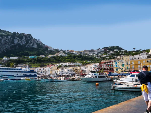 The port on the Isle of Capri in Italy.Capri has been a resort island since Roman times . It is situated in the Bay of Naples and is covered with architecture from all the successive generations