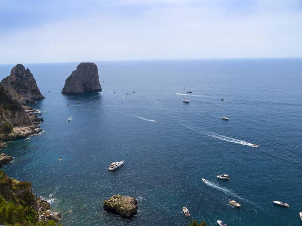 The Iconic Faraglioni Rocks off the Isle of Capri as seen from the clifftops.Capri has been a resort island since Roman times . It is situated in the Bay of Naples and is covered with architecture from all the successive generations