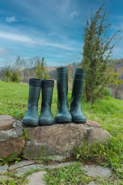 Rubber boots on green grass