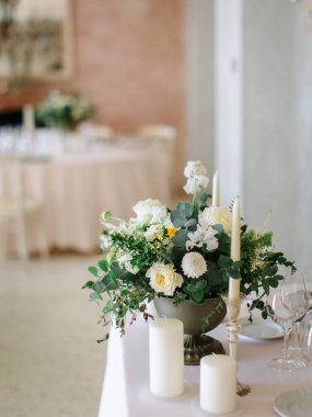 wedding decor, served tables, ivory, with candles, glasses, beautiful wooden tables, inside the Italian old Villa