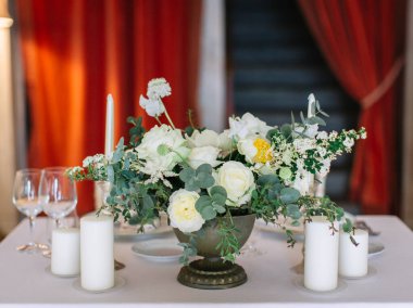 wedding decor, served tables, ivory, with candles, glasses, beautiful wooden tables, inside the Italian old Villa