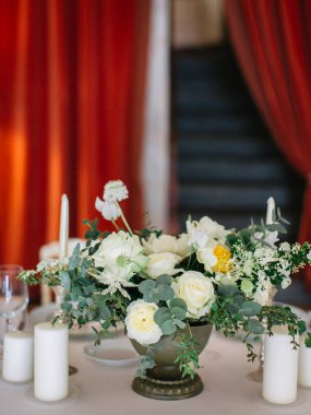 wedding decor, served tables, ivory, with candles, glasses, beautiful wooden tables, inside the Italian old Villa