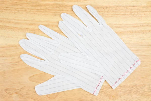 Белые Перчатки Деревянной Доске — стоковое фото