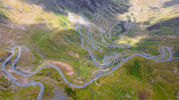 Drone photography of the famous Transfagarasan Road, in Romania. Photography was taken from a drone with camera tilted downwards for a top shot of the curvy road.