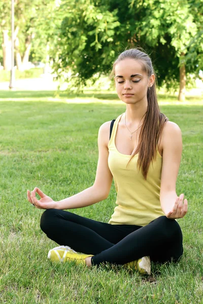 A girl performs exercises of yoga Stock Image