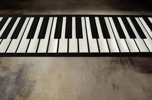 Close Flat Piano Keyboard Top View Piano Keys Textured Concrete — Stock Photo, Image