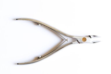 Cuticle trimmer isolated on a white background. Manicure and pedicure nail care tool. Top view.