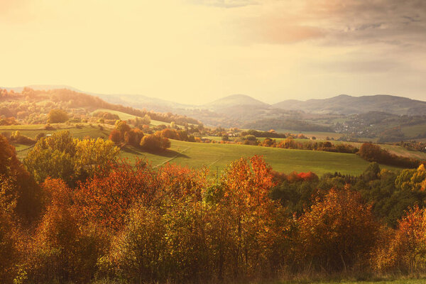 Rural landscape on a sunny day in autumn.Mountains in background. High quality photo