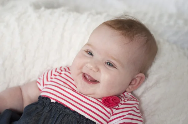 Happy laughing beautiful newborn baby — Stock Photo, Image