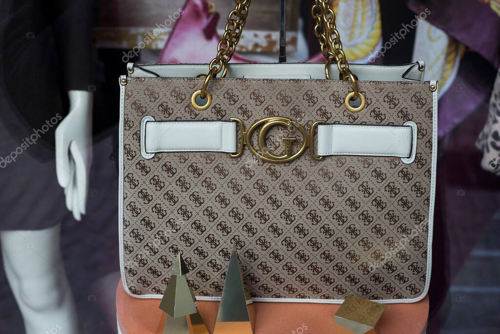 Colmar - France - 13 November 2021 -  Closeup of brown leather hand bag by Gucci in a luxury fashion store showroom