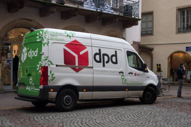 Strasbourg - France - 18 December 2021 - Profile view of dpd logo on delivery truck by mercedes parked in the street