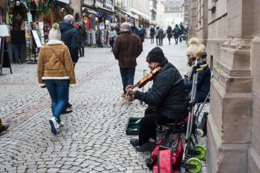 Strasbourg - France - 18 December 2021 - Portrait of violinist  playing in the street