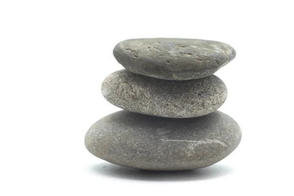 特写镜头的石头平衡在白色背景 — 图库照片