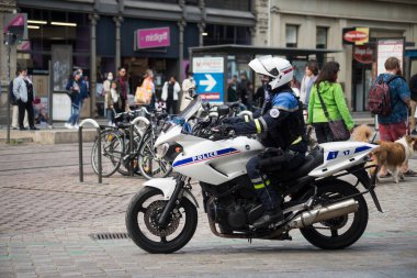 Strasbourg - France - 30 April 2022 - Portrait of french national policeman and motorbike in the street 