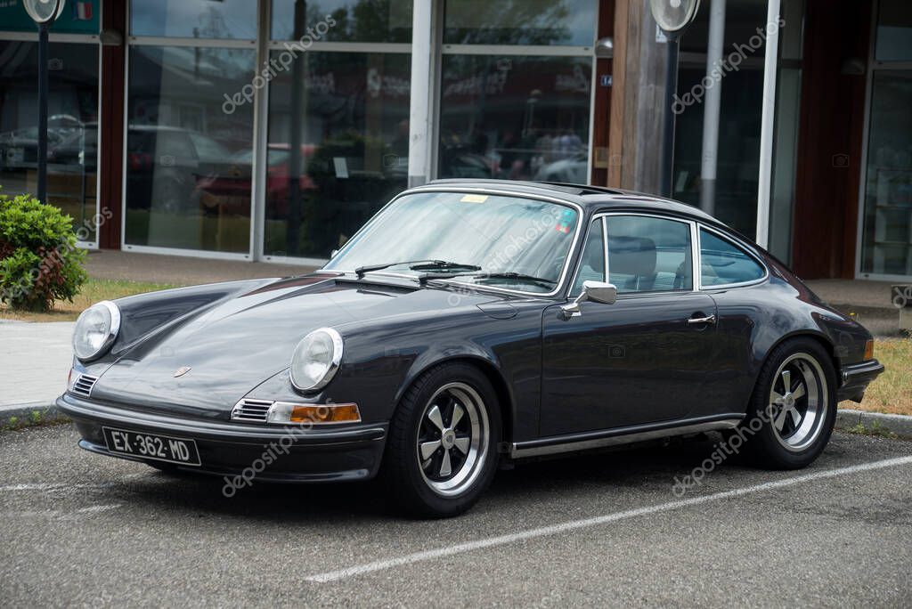 Lutterbach - France - 5 June 2022 - Front view of grey vintage Porsche 911 parked in the street