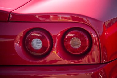 Lutterbach - France - 4 July 2022 - Rear ligts of red ferrari 360 modena parked in the street
