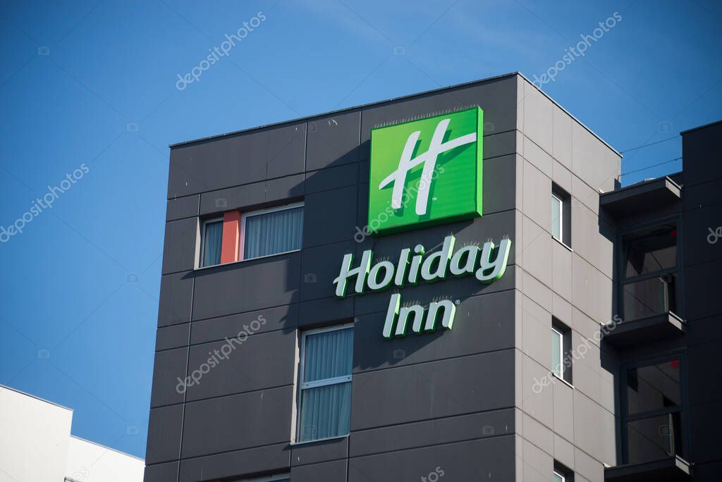 Mulhouse - France - 2 August 2022 - Holiday inn hotel logo on modern building. Holliday Inn is an americain chain company of hostelry
