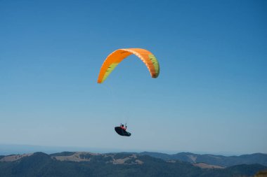 Le grand Ballon - France - 4 August  2022 - View of paraglider flying on blue sky background
