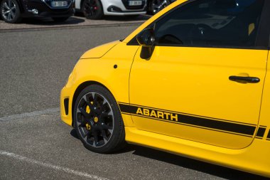 Lutterbach - France - 18 Aout 2022 - Front view of yellow Abarth 595 parked in the street 